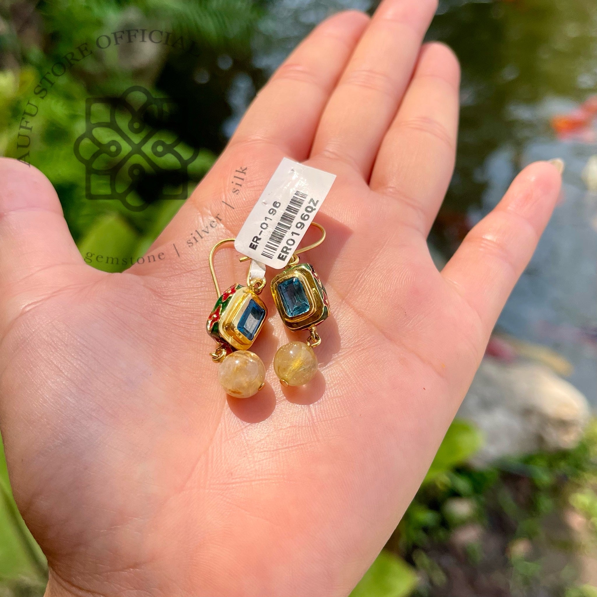 ต่างหูบลูลอนดอนประดับไหมทอง รุ่น “Skyline Aura” “ฟ้าเรืองทอง” Skyline Aura – London Blue Topaz & Rutilated Quartz Earrings