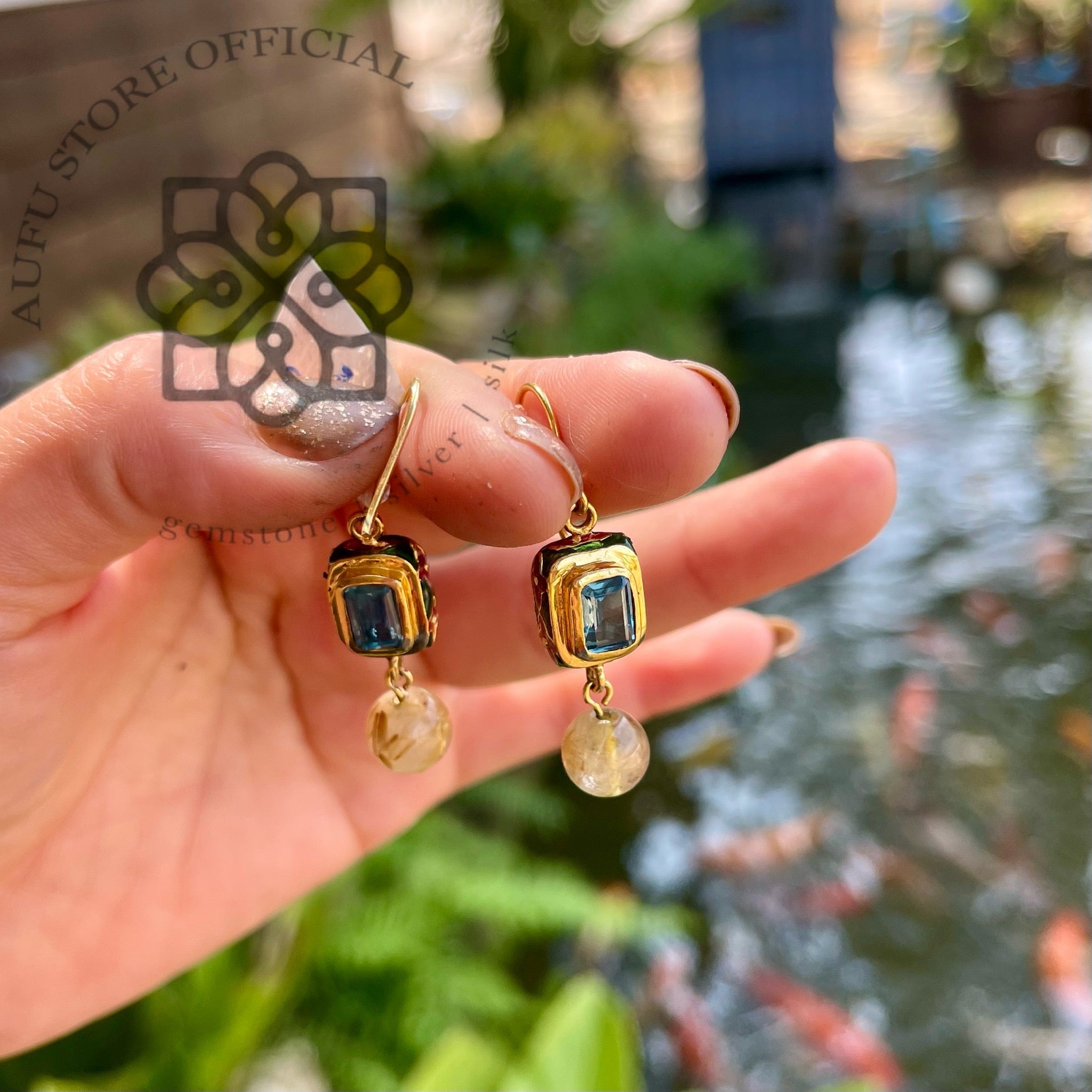 ต่างหูบลูลอนดอนประดับไหมทอง รุ่น “Skyline Aura” “ฟ้าเรืองทอง” Skyline Aura – London Blue Topaz & Rutilated Quartz Earrings