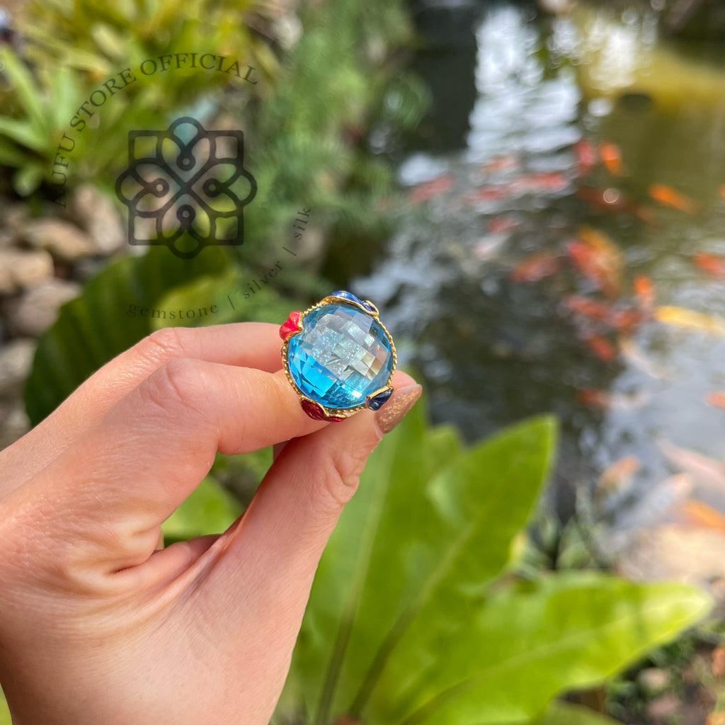 แหวนลงยาโบราณประดับบลูโทปาส รุ่น “Azure Majesty”  Azure Majesty – Royal Enamel Blue Topaz Ring