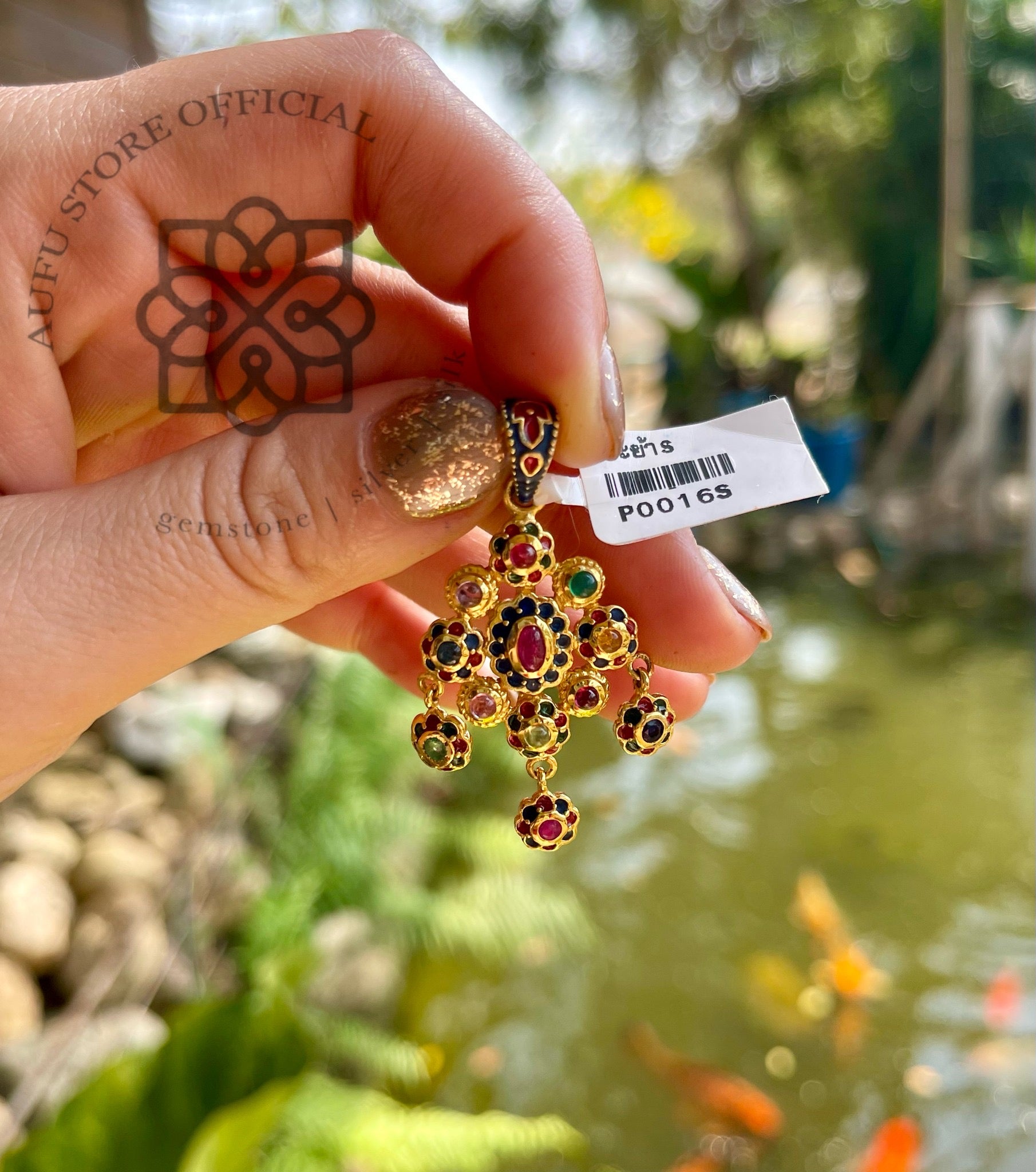 จี้นพเก้าทรงห้อยระย้า รุ่น “Royal Lotus Charm” หรือแบบไทยหรู: มณีจักรพรรดิ Royal Lotus Charm – Ruby Navaratna Pendant