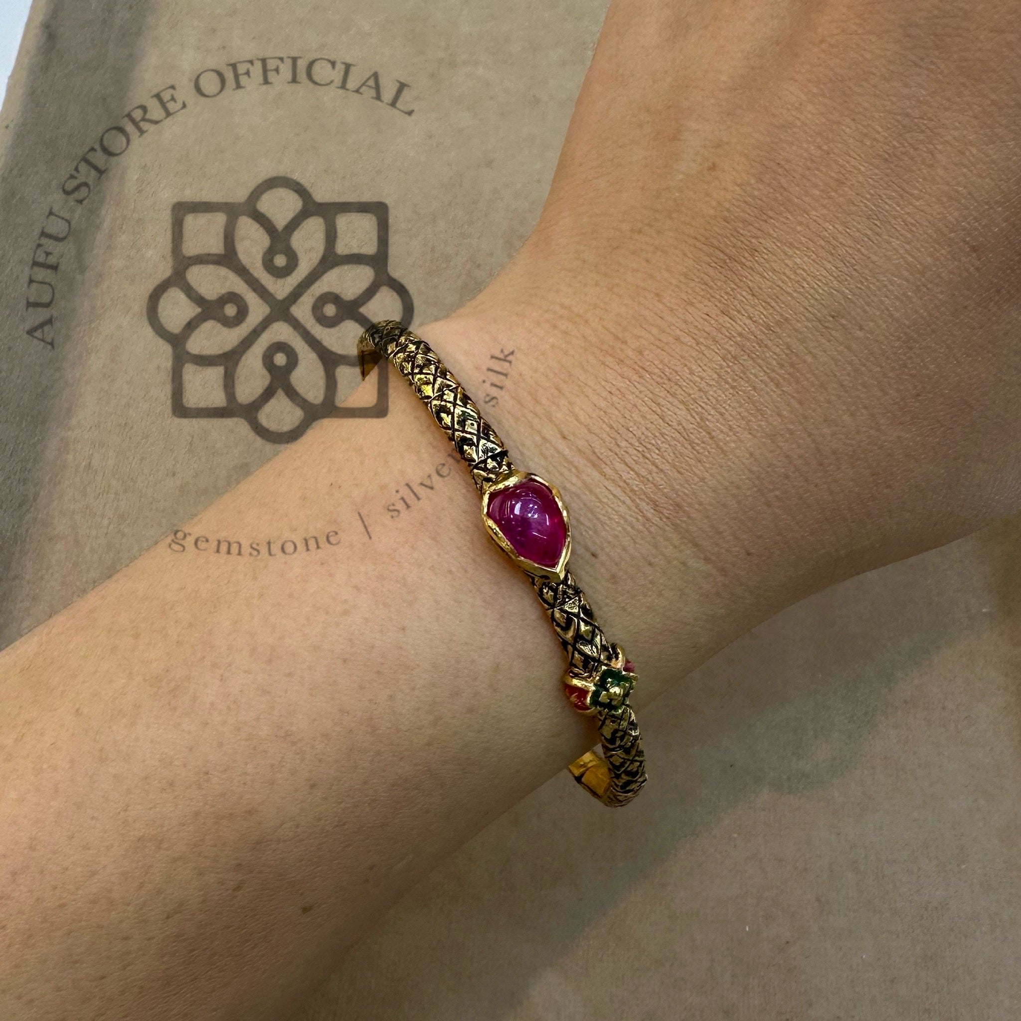 กำไลทับทิมโบราณ รุ่น “Ruby Serpent Grace” “นาคราชาแดง” Ruby Serpent Grace – Antique Ruby Cabochon Bangle